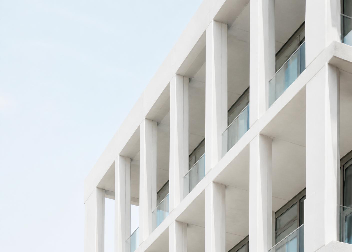 Bright modern architectural facade with repeating geometry